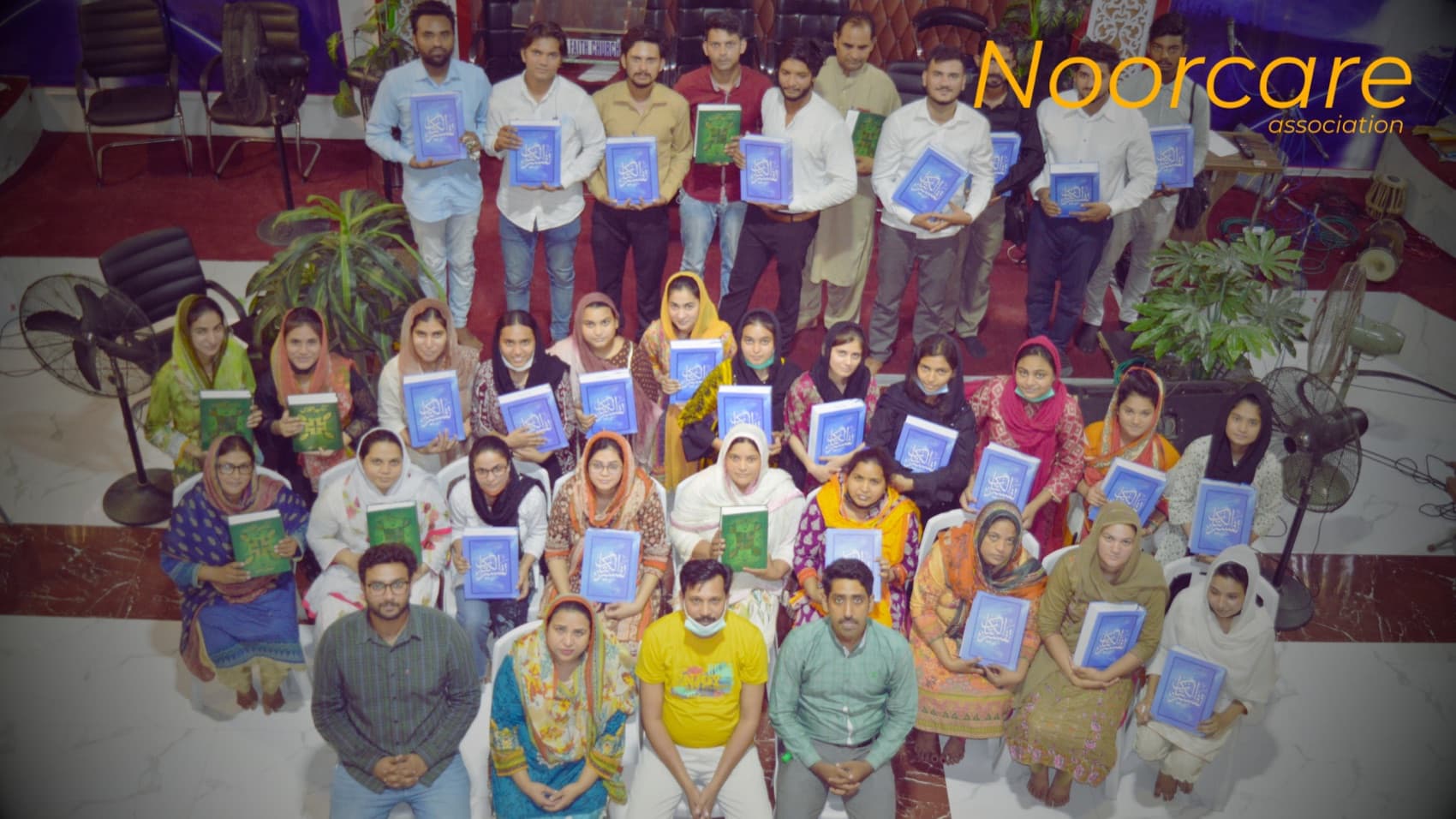 A large group of schoolchildren from the NoorCare community