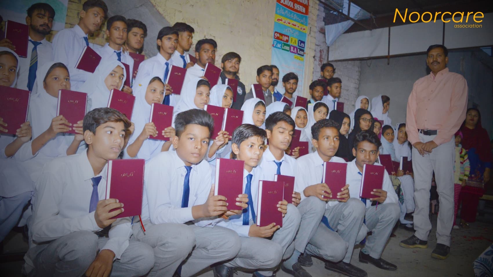 Students in uniform holding their books